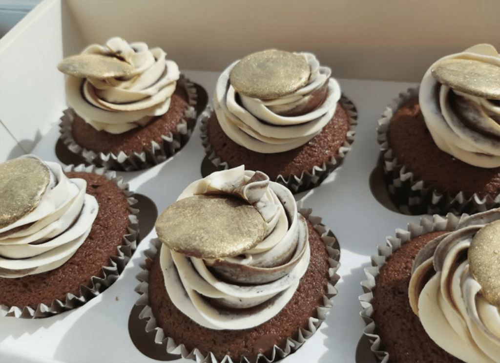 Chocolate cupcakes with gold dusted chocolate buttons made by Julies Cake Company St Albans