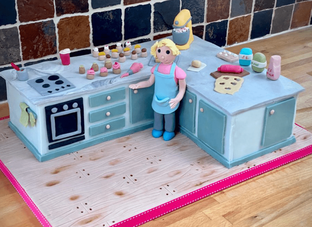 Kitchen Cake, in pale blue with handmade sugar decorations designed by Julies Cake Company St Albans