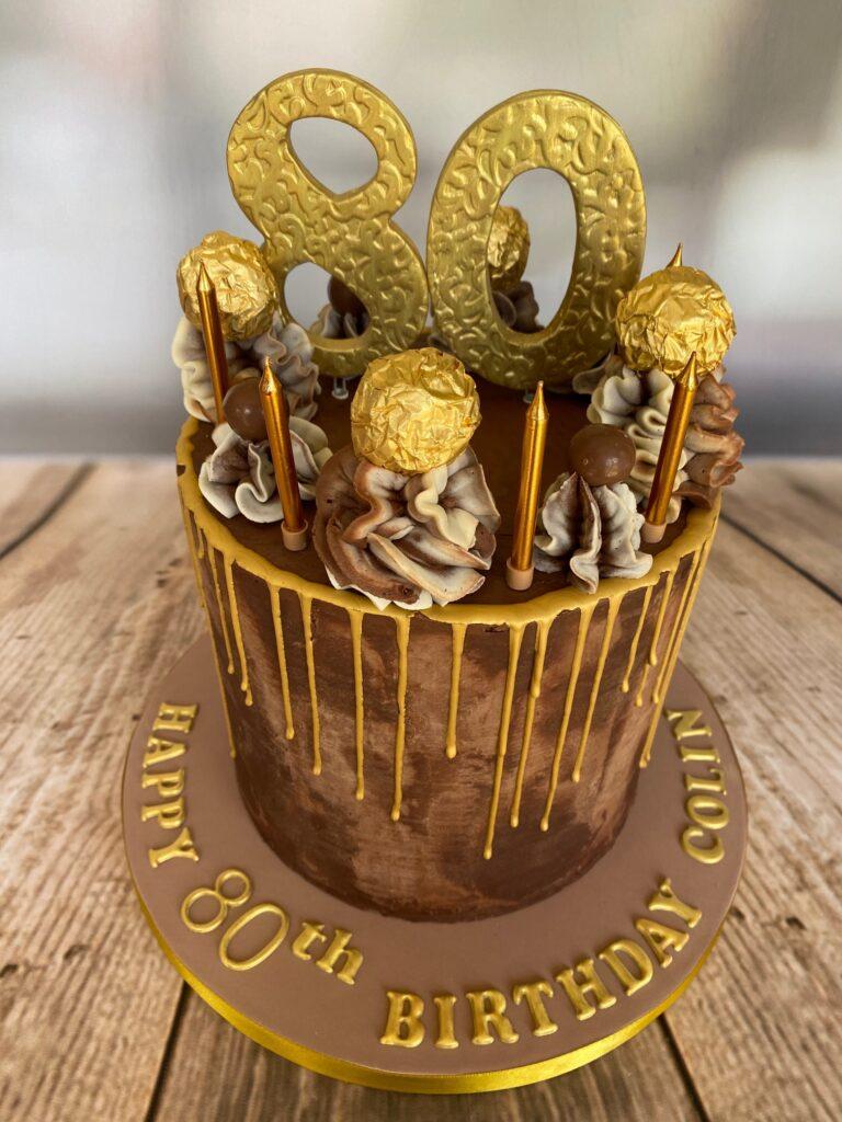 80th birthday chocolate cake, with Ferro Rocher and gold numerals made by Julies Cake Company