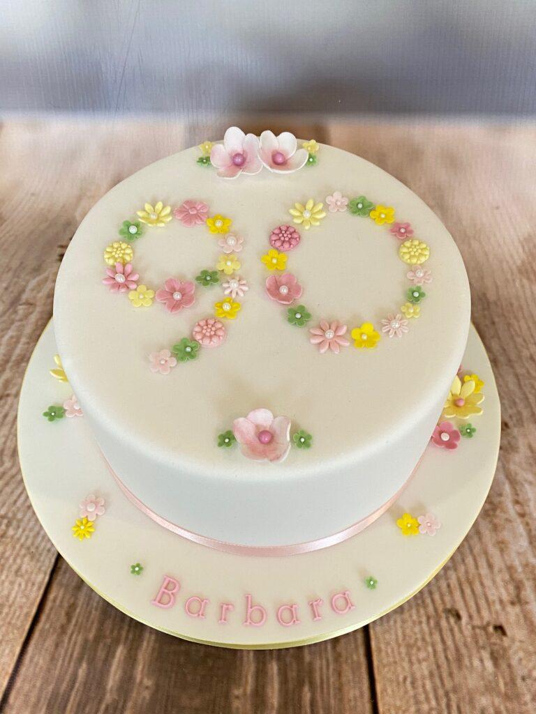 90th vanilla birthday cake with hand made flowerslove Julies Cake Company St Albans