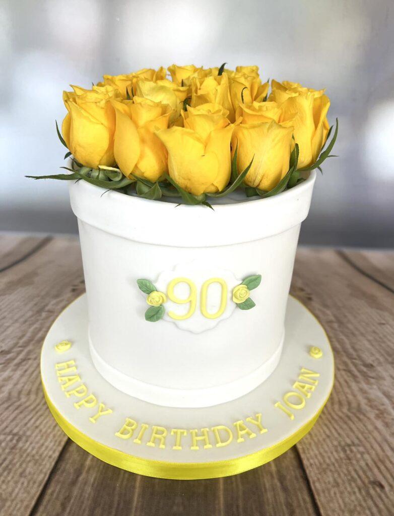 Hat box cake filled with fresh yellow roses