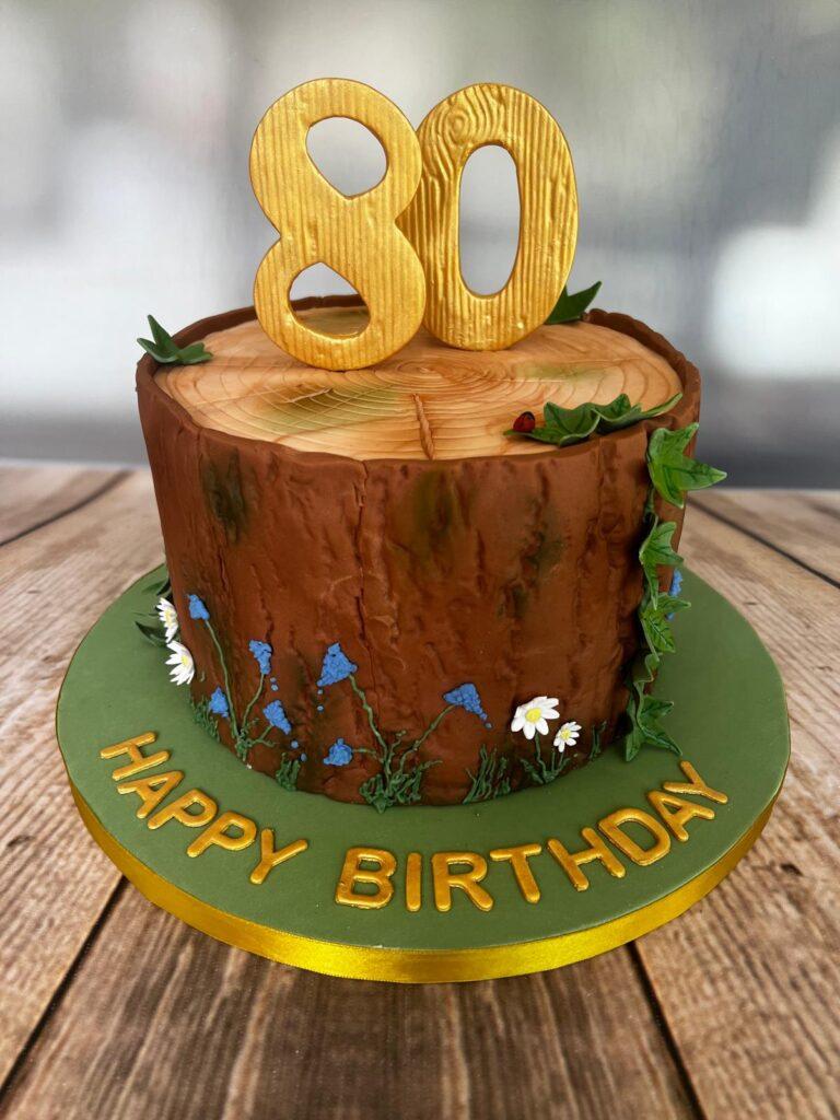 80th birthday tree trunk cake. complete with large hand made numbers.