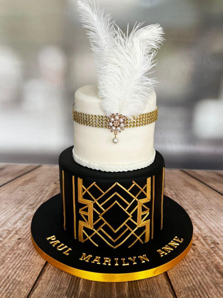 Black and white 1920's cake with gold art deco detail.
