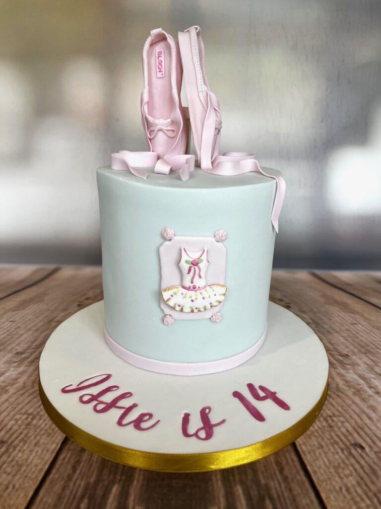 Birthday cake for a ballet dancer, With hand made pink sugar ballet ballet shoes.