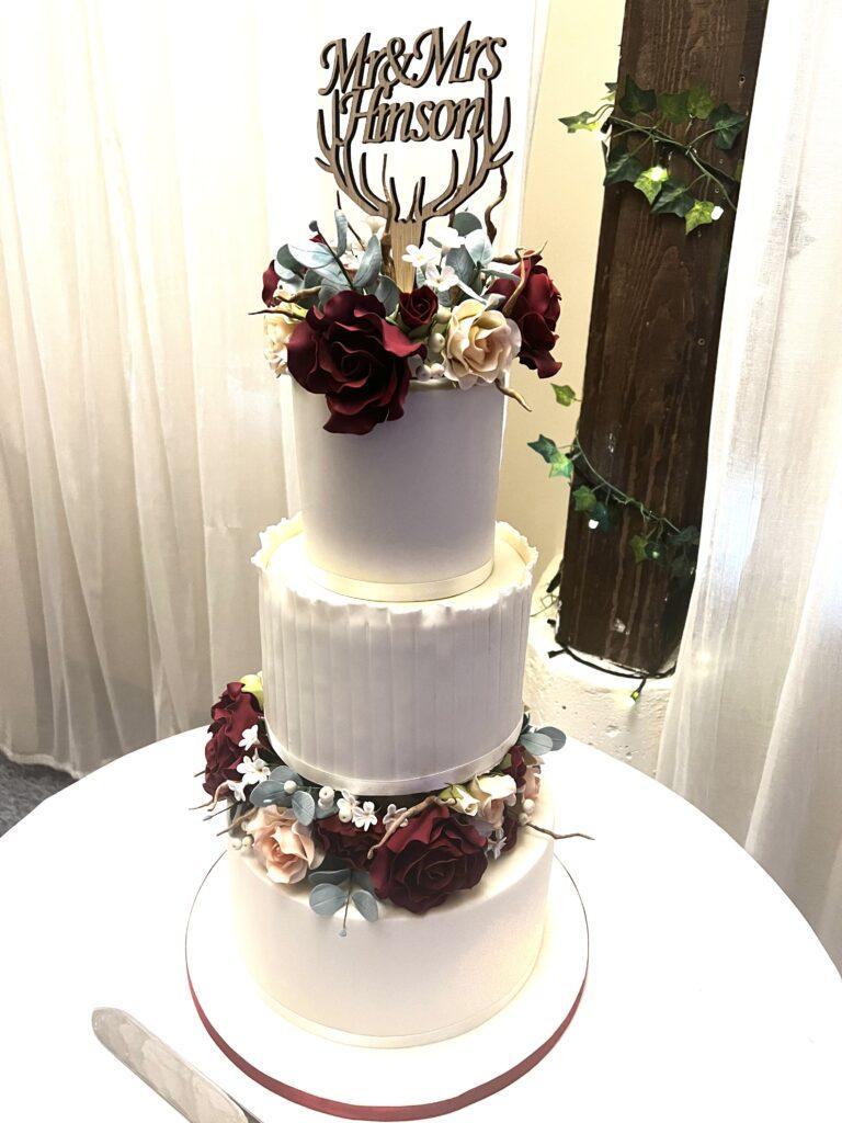 3 tier wedding cake with handmade sugar flowers